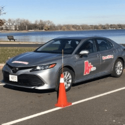 Happy children playing a game at a table and smiling at camera